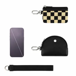 Detailed view of mini checkerboard coin purse and wrist strap size dimensions for comparison.