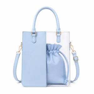 Transparent PVC tote bag detail view featuring matching blue PU leather inner drawstring pouch.