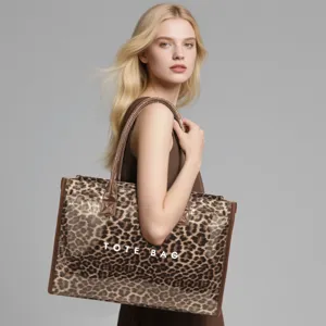 Detailed view of the large capacity leopard print transparent PVC tote bag with double handles.