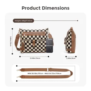 Detailed view of black and white checkerboard crossbody bag with adjustable strap and front pockets.