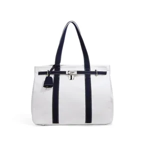 White and dark blue canvas tote bag with metal lock closure, stylish shoulder handbag.