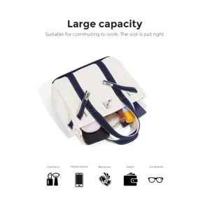Small canvas tote bag with contrast color design, metal lock decoration and adjustable strap.