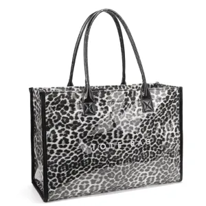 Detailed view of the black and white leopard print transparent PVC tote bag with dual handles.