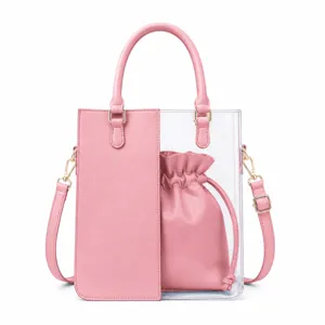 Clear PVC tote bag detail showing pink PU leather panel and inner drawstring pouch.
