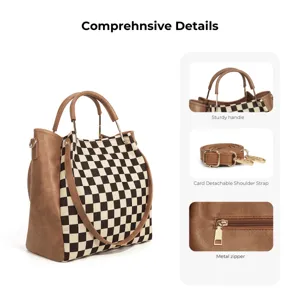 Detail view showing sturdy handle, detachable shoulder strap, and smooth metal zipper.
