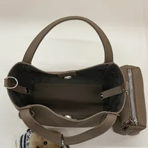 Detailed top view of retro PU bucket bag interior, zipper and leather texture showcase.