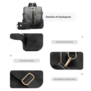 Stylish black and white leopard print backpack set with matching clutch and gold hardware.