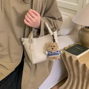 Retro pebbled PU leather bucket bag with cute bear pendant, stylish handbag for women.