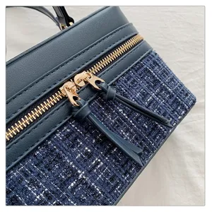 Blue tweed leather vanity box bag detail shot, vintage chic plaid handbag with gold zippers.