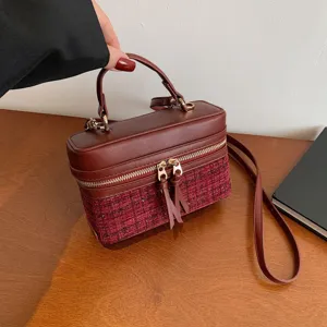 Vintage plaid tweed box handbag with top handle and gold zipper for stylish women.