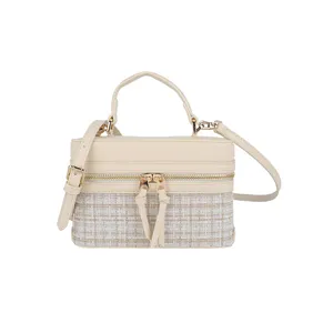 Elegant tweed and leather vanity box bag with top handle and strap for women stylish use.