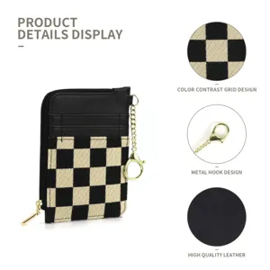 Black and white checkerboard card wallet with zipper and gold keychain, minimalist style.