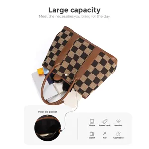 Detailed view of the large capacity checkerboard canvas tote bag showing inner pocket and storage.