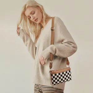 Stylish canvas checkered crossbody bag with adjustable shoulder strap for women daily use.