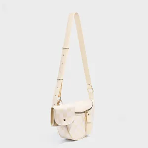 Checkered crossbody bag detail, cream nylon shoulder bag with small pouch and gold hardware.