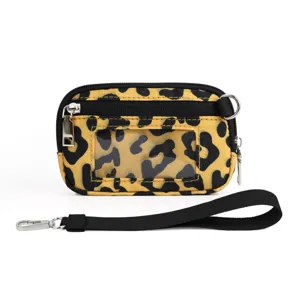 Leopard print card holder wristlet with clear PVC window and black strap detail.