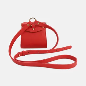Red PU leather mini storage bag, cute earphone pouch with thin strap and golden ring detail.