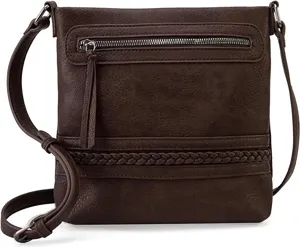 Brown women's crossbody bag detail showing zipper pocket, stylish braided texture and strap.