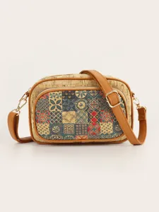 Detailed view of retro cork crossbody bag with geometric mosaic front pocket and brown strap.