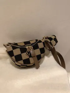 Crossbody checkered canvas chest bag with small earphone pouch, versatile fashion design.