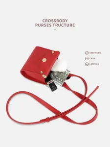 Red PU leather mini crossbody bag and earphone pouch with slim strap for daily use and storage.