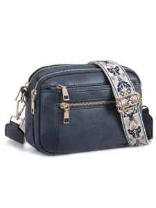 Dark blue PU leather crossbody bag with multiple zippers and wide embroidered strap details.