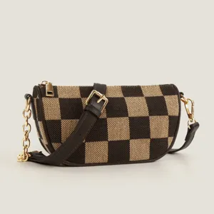Brown checkerboard crossbody bag with leather strap and gold chain detail for women.