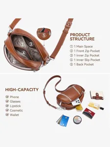 Detail view of the brown leather baseball shaped crossbody bag showing internal multi-pocket structure.