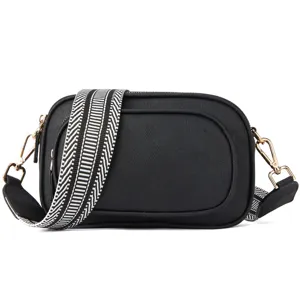 Black crossbody bag for women, stylish wide patterned strap camera bag with gold hardware.
