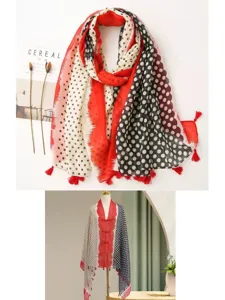 Detailed view of retro polka dot cotton linen shawl with tassels and ethnic print design.