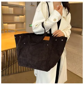 Detailed view of women's large capacity corduroy tote bag, stylish retro shoulder handbag.