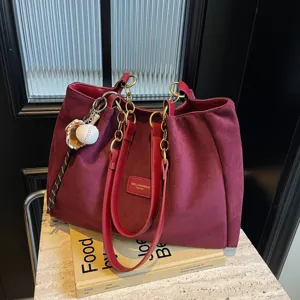 Burgundy suede tote bag with shoulder straps, large capacity casual fashion handbag.