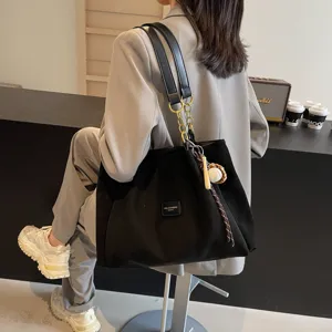 Stylish black suede tote bag for women, large capacity shoulder bag for daily commute and school.
