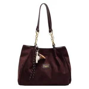 Brown suede large capacity tote bag for women, stylish shoulder bag with chain straps and charms.