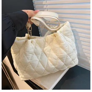 Large capacity quilted tote bag for women, stylish puffer shoulder bag with chain straps.