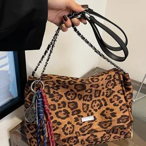 Trendy leopard print shoulder bag for women, chic crossbody purse with chain strap for daily wear.