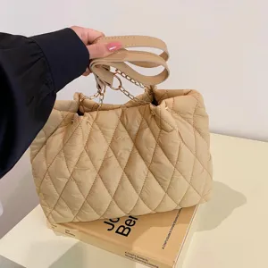 Large capacity quilted tote bag for women, trendy winter shoulder bag with stylish chain design.