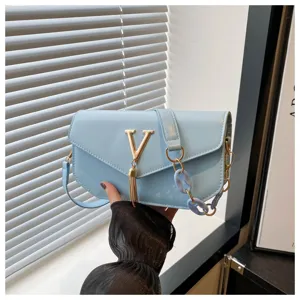 Simple fashion light blue crossbody shoulder bag with gold V hardware and tassel charm.