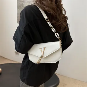 White patent leather shoulder bag for women, stylish crossbody bag with V-logo and chain.