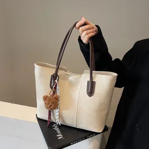 Vintage large capacity tote bag for women, stylish PU leather shoulder bag for commute.