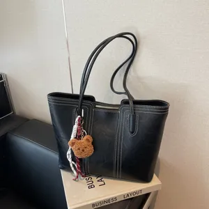 Large black tote bag for women, vintage shoulder bag with cute bear pendant and stitching.
