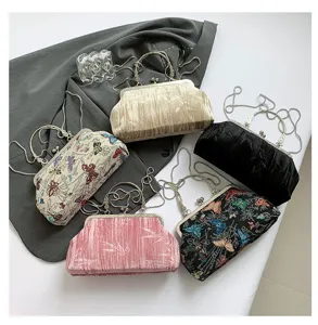 Vintage Chinese style kiss-lock evening clutch bag with chain strap and embroidered butterfly design.