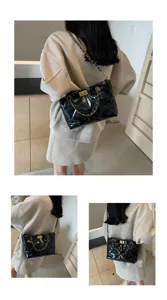 Schwarze gesteppte Kettentasche für Damen, stylische Umhängetasche mit großem Volumen.