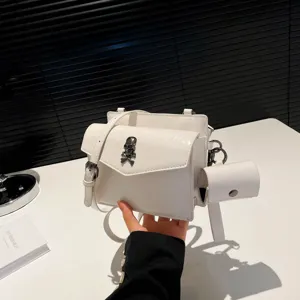 White crossbody small square bag with unique skull pendant, fashionable trendy stylish everyday.
