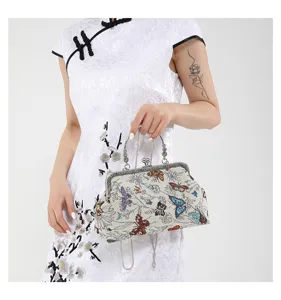 Chinese style retro butterfly embroidered kiss-lock handbag detail view, elegant qipao matching accessory.