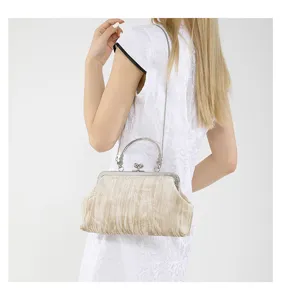 Retro velvet kiss-lock shoulder bag for women, elegant cheongsam chain handbag with metal handle.