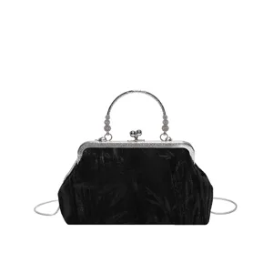 Chinese vintage black velvet handbag with silver metal handle and chain strap for women.