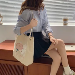 Japanese style corduroy shoulder tote bag with cute embroidery, ideal for daily student use.