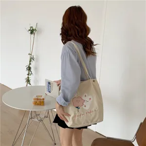 Japanese style corduroy tote bag with cute rabbit and flower embroidery for daily use.