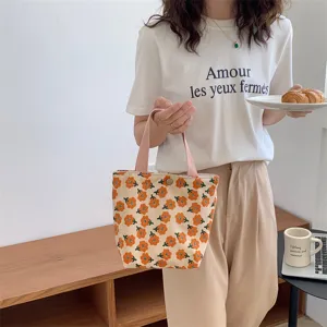 Cute corduroy lunch box handbag with orange daisy print, perfect for daily casual use.